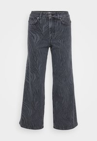 Videbukser i mørkegrå denim med et zebrastripemønster. Klassisk fem-lomme-design med knap- og lynlåslukning.