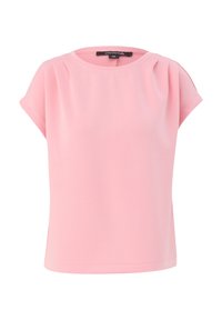 Blouse rose clair à manches courtes, col rond et légers plis près des épaules, présentée sur fond blanc.