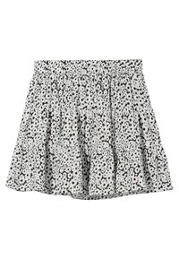 White skirt with black daisy floral print, tiered ruffles, and elastic waistband, displayed flat on a white background.