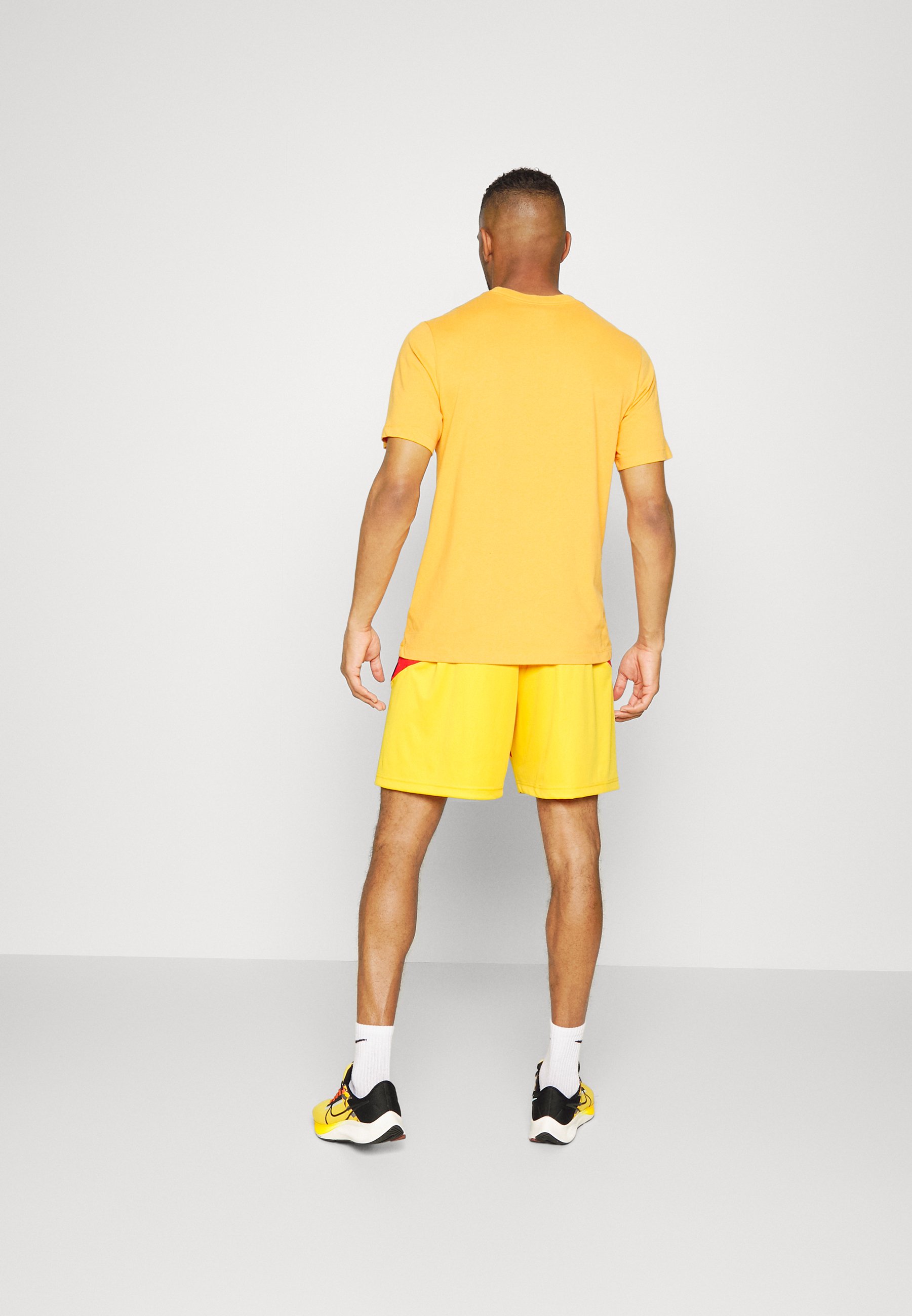 nike university gold shorts