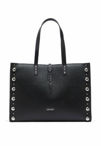 Sac cabas en cuir noir à la forme structurée, orné de clous argentés sur un côté, avec des accents métalliques et un détail de fermeture à l'avant.