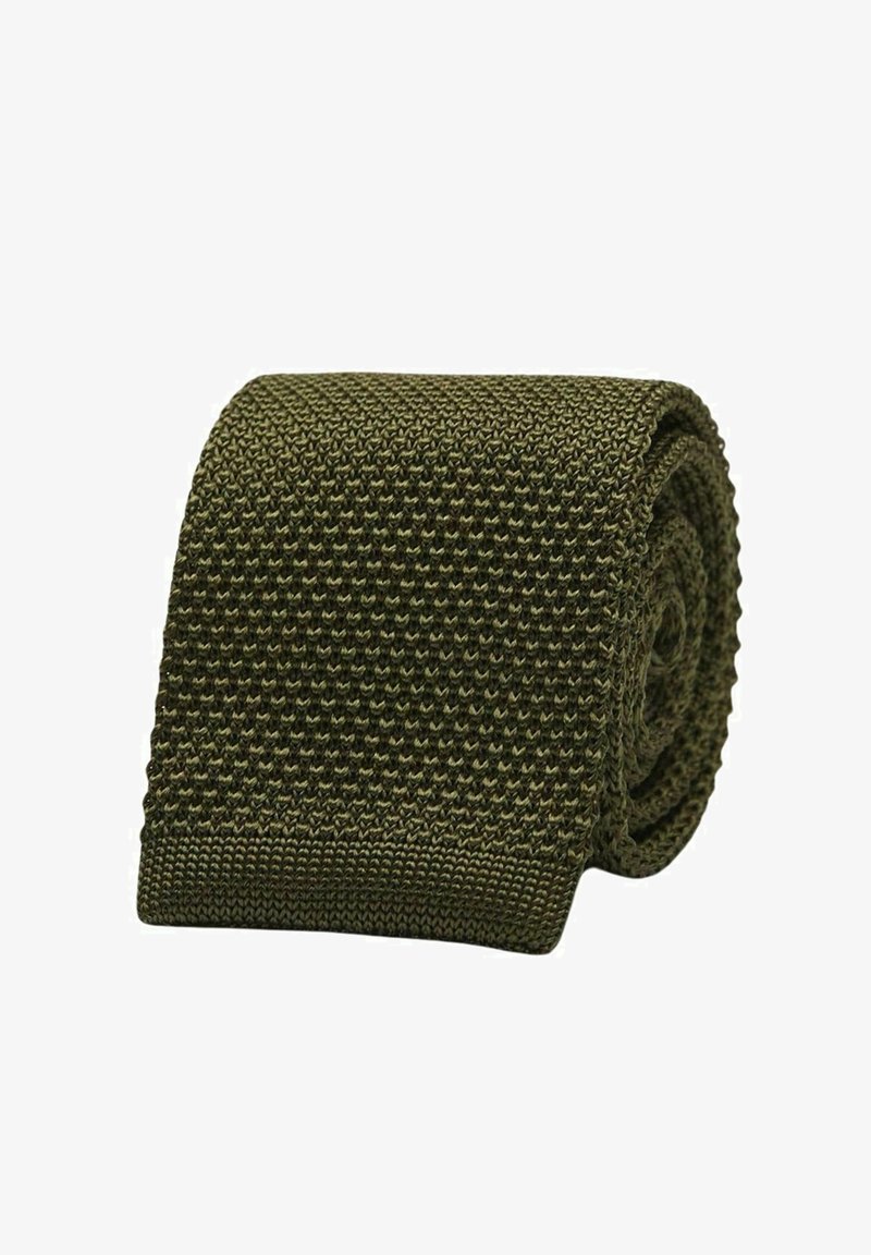 Neulottu solmio oliivinvihreänä, valmistettu teksturoidusta materiaalista, jossa on hienovarainen kuvio. Rullattu muotoilu, jossa on sileä pinta ja tasainen muoto.