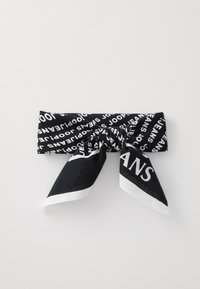 Black scarf with white text featuring the word "JEANS," styled in a knot with two pointed ends, made from soft fabric.