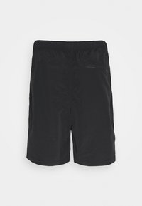 Pantaloni corti neri realizzati in tessuto leggero, dotati di vita elastica e di una tasca posteriore con zip per una conservazione sicura.