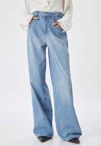 OVERSIZED  - Flared Jeans - blue denim
