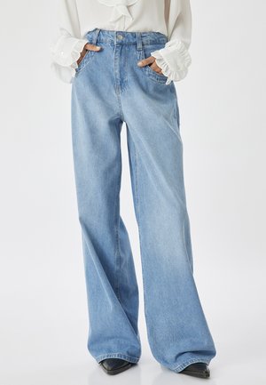 Light blue wide-leg jeans made from denim, featuring a high waist, two front pockets, and a clean, minimal design.