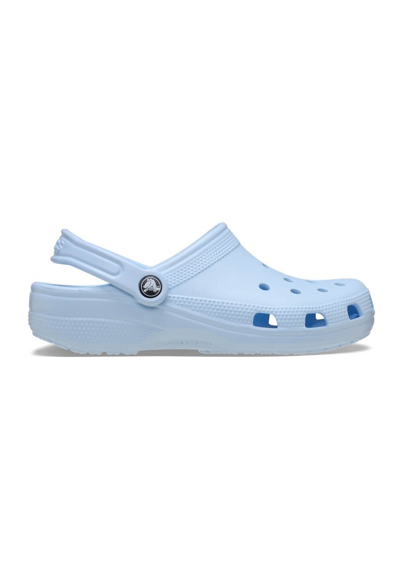 Light blue clogs with a closed toe and open heel. Textured upper featuring ventilation holes and a black logo accent on the side.