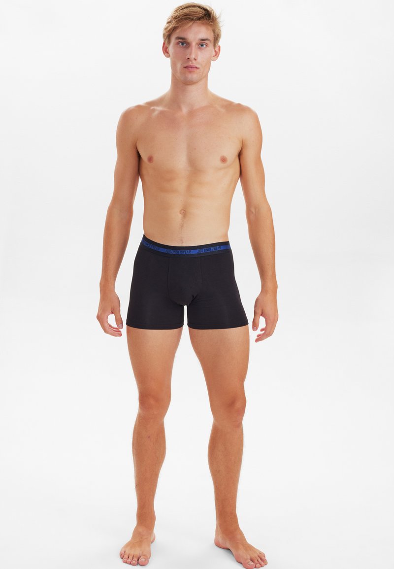 Black boxer briefs with a blue elastic waistband, made from a smooth, stretchy fabric. The design is form-fitting and mid-thigh length.