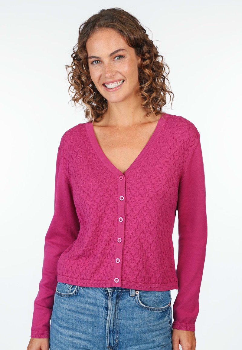 Fuchsia cardigan with a V-neck, button closure, and textured diamond pattern on the front. Long sleeves and ribbed hem.