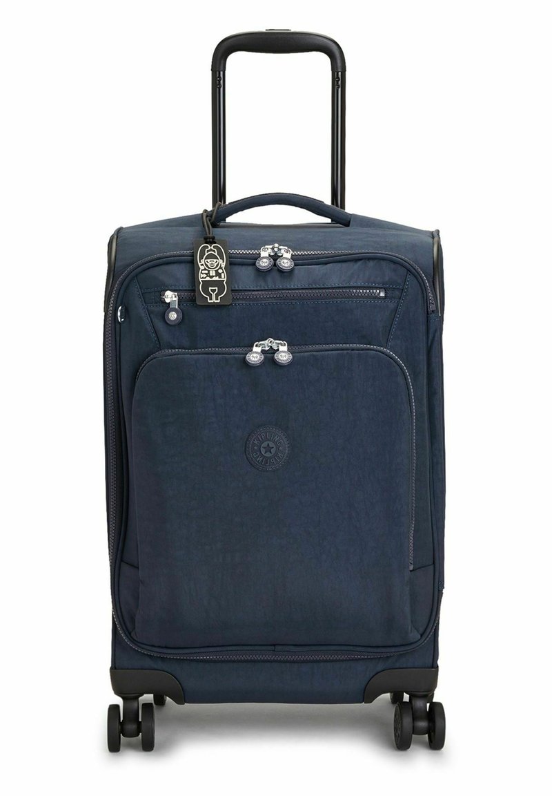 Navy hard-shell suitcase with retractable handle, four wheels, front zipper pocket, and a decorative luggage tag. Textured surface and logo.