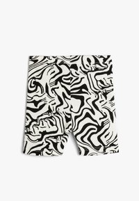 Sort og hvide shorts med et bølget, abstrakt mønster. Lavet af ribbet stof med en strækbar tekstur. Mid thigh længde.