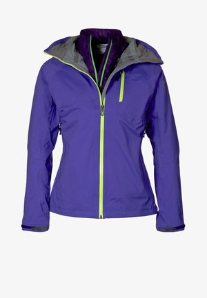 Chaqueta deportiva para mujer de color púrpura con cremalleras verde lima, bolsillo en el pecho y capucha, mostrada de frente sobre un fondo blanco.