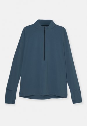 Long-sleeve pullover in dark blue fabric, featuring a zip collar, raglan sleeves, and slits at the cuffs. Smooth, lightweight texture.