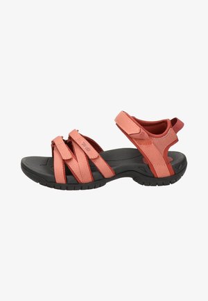 Women's sandals with pink fabric straps and black rubber soles. Features adjustable straps for a secure fit and a contoured footbed.