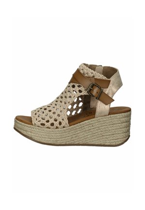 Wedge sandals with a woven beige upper and brown leather straps, featuring a textured rope sole and an open-toe design.