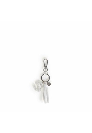 Portachiavi con un charm argentato glitterato a forma di 'S', nappina bianca e anello in metallo. Caratterizzato da una chiusura argentata e un piccolo tag rotondo.