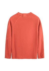 Pullover corallo a maniche lunghe con scollatura rotonda, fessure laterali e maniche raglan, con etichetta cucita sul retro. Tessuto morbido.