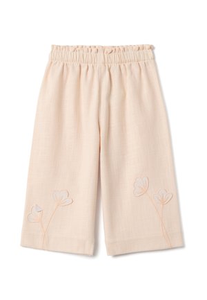 Pantalones de pierna ancha color melocotón claro con cintura elástica y delicados bordados florales cerca del dobladillo en cada pierna.