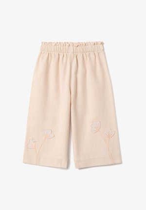 Pantalon ample couleur pêche clair avec taille élastique et délicate broderie florale près de l'ourlet sur chaque jambe.