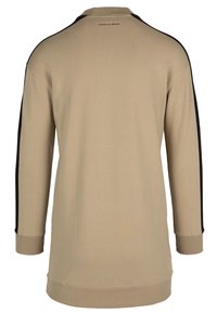Camisa de manga larga beige con paneles laterales negros, cuello redondo, tejido suave y un logo en la parte posterior. Presenta un corte recto y puños acanalados.