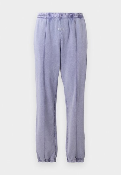 Light purple sweatpants with an elastic waistband, featuring visible stitching lines and a tapered leg design. Smooth texture, casual fit.