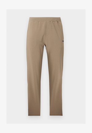 Béžové legíny s texturou s vysokým elastickým pasem, úzkým střihem a jemným logem značky na pravém stehně.