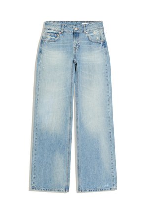 Jean bleu clair à jambes larges avec poches avant, fermeture par boutons et légère décoloration usée sur le haut des cuisses et près des poches.
