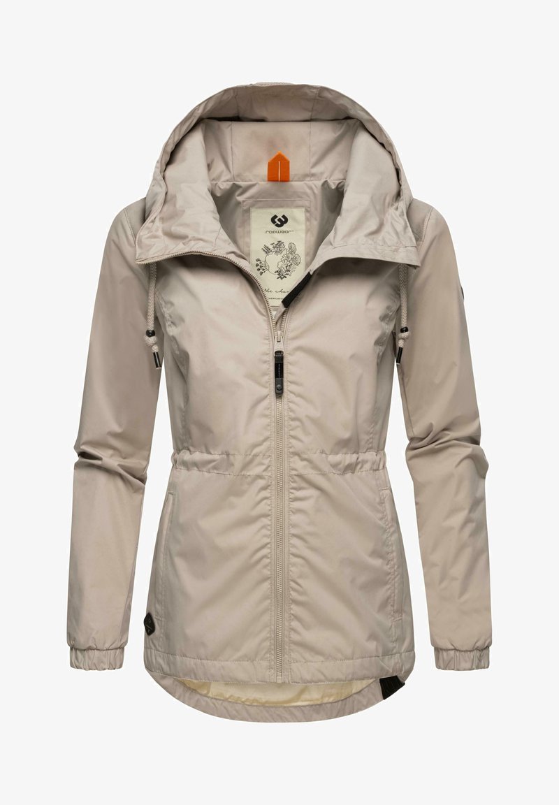 Jachetă de vânt de culoare bej deschis, cu fermoar în față, glugă ajustabilă și măneci elastice. Prezintă un model floral în interior și detalii cu logo.