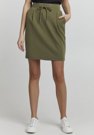 Olive green skirt made of soft fabric, featuring an elastic waistband with adjustable drawstring, two side pockets, and a fitted silhouette.