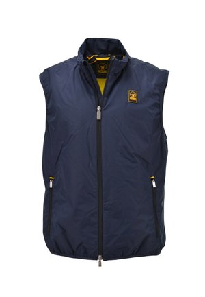 Gilet senza maniche blu navy con cerniera, colletto alto, due tasche con zip e toppa con logo giallo sul petto e all'interno del colletto.