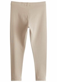 Leggings en coton beige avec une taille extensible, une coupe ajustée et une texture lisse. Pas de motifs ou d'accents visibles.