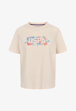 Ljus krämfärgad bomullströja med korta ärmar som har en färgglad blommönstring runt texten "U.S.A" i feta bokstäver.