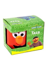 Tazza di ceramica rossa con il volto di un personaggio dei cartoni animati, caratterizzato da grandi occhi e un naso arancione, confezionata in una colorata scatola di cartone verde.