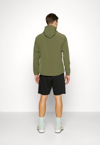 Nike Performance UNLIMITED - Trainingsjacke - medium olive/black