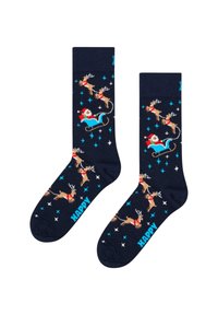 Chaussettes bleu marine ornées de rennes et du Père Noël dans un traîneau, avec des accents colorés et des motifs d'étoiles. "HAPPY" imprimé en bleu sur l'orteil.