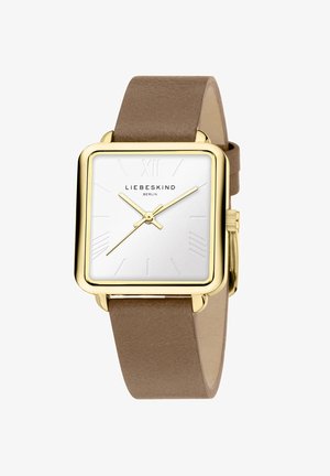 Kvadratisk ur med en sølvskive, guldramme og beige læderrem. Har romerske tal og minimalistiske time markører.