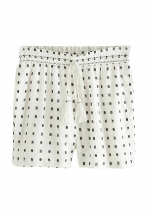 Weiße Shorts mit schwarzen geometrischen Mustern, elastischem Bund mit Kordelzug und Quaste-Akzenten; gefertigt aus leichtem, strukturiertem Stoff.