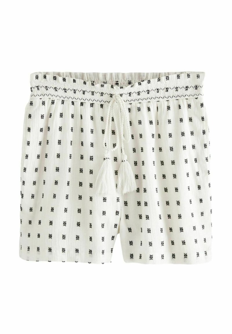 Weiße Shorts mit schwarzen geometrischen Mustern, elastischem Bund mit Kordelzug und Quaste-Akzenten; gefertigt aus leichtem, strukturiertem Stoff.