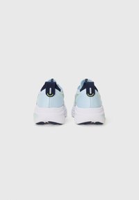 Light blue athletic shoes with white outsoles, navy accents, and a textured upper. Features a loop at the heel for easy wear and movement.