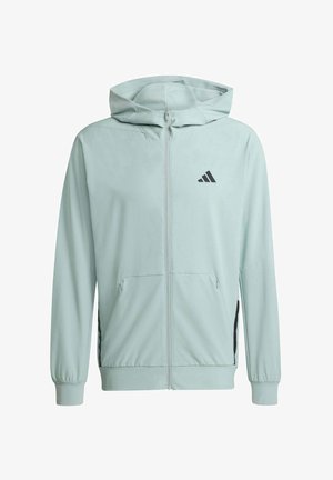 Felpa con cappuccio azzurro chiaro con cerniera frontale completa, tasche anteriori, polsini elastici, cappuccio e piccolo logo nero a tre strisce sul petto sinistro.