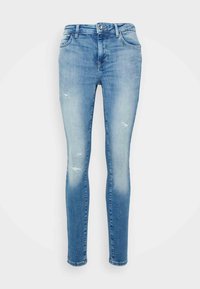 Uske uski dioje (skinny fit) traperice u svijetloplavom denimu, sa izblijeđenim područjima, pohabanim detaljima i klasičnim dizajnom s pet džepova i zatvaračem.