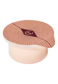 Light pink round container with a textured, peach-colored lid featuring a geometric design in burgundy and radiating line patterns.