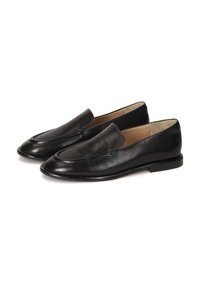 Black leather loafers with a sleek, curved design, smooth texture, and a low-profile sole. Features a front seam detail.