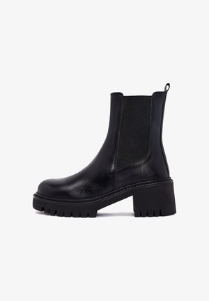 Black leather ankle boots with textured elastic side panels, chunky heel, and rugged outsole. Features a pull tab for easy wear.
