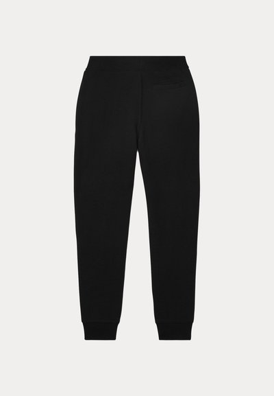 Pantalon de jogging noir fuselé avec taille élastique, chevilles retroussées et une seule poche passepoilée au dos, présenté sur un fond uni.