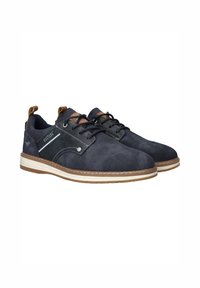 Navy blue shoes with a textured fabric upper, featuring brown accents, traditional laces, and a rubber sole with stitched detailing.