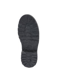 Schwarze Gummisohle mit strukturierten Profilmustern und einem abgerundeten Fersenbereich. Label in der Mitte eingeprägt.