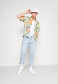 Levi's® 511 SLIM - Calças de ganga de perna direita - light indigo worn in