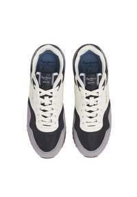 Sneakers with a mix of black fabric, cream leather, and grey suede accents. Features white laces and a logo on the tongue and side.