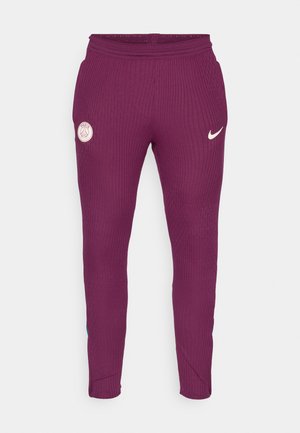 Paars geribde joggingbroek met een Nike-logo en een Parijs-embleem op de linker dij. Elastische tailleband en taps toelopend ontwerp bij de enkel.